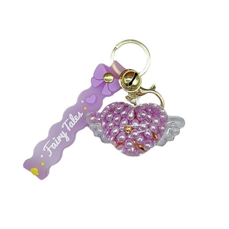 Wholesale Oil-infused Golden Bean Wing Heart Keychain